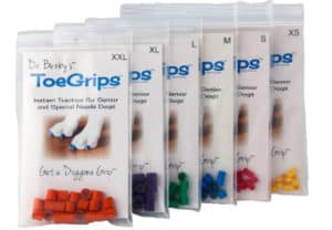 Dr. Buzby's ToeGrips dog nail grips packages in variety of sizes. Photo.