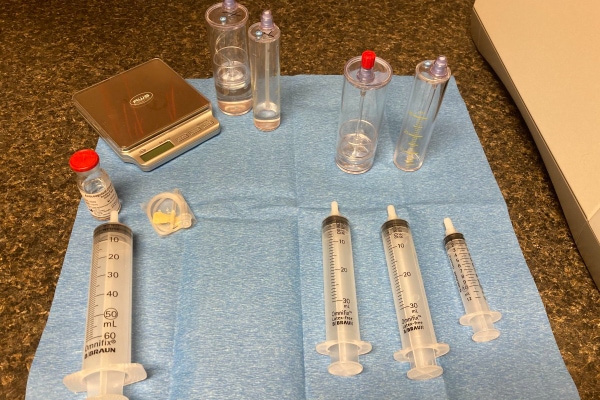Set up of vials and syringes for PRP injection.