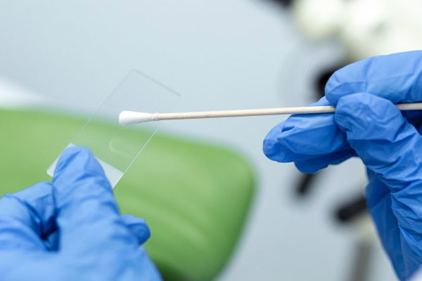 Vet performing cytology