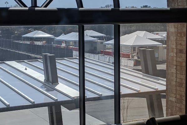 view from a window overlooking a tent city in preparation for the coronavirus. photo 