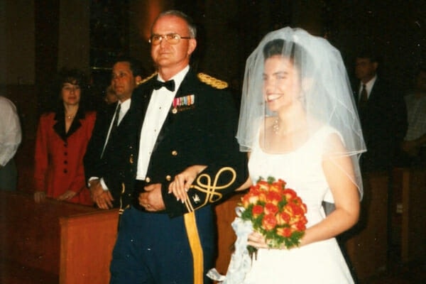 Dr. Julie Buzby with her dad walking down the aisle on her wedding day, photo