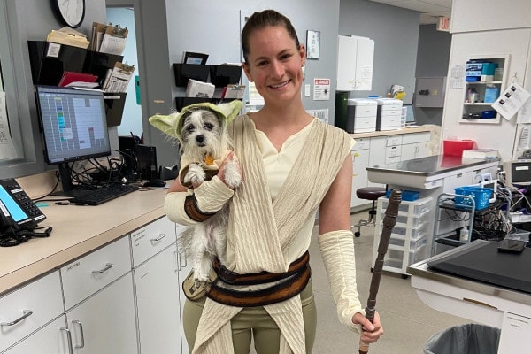Dog and owner wearing matching halloween costumes