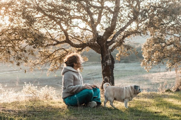 Owner with her dog in the forest