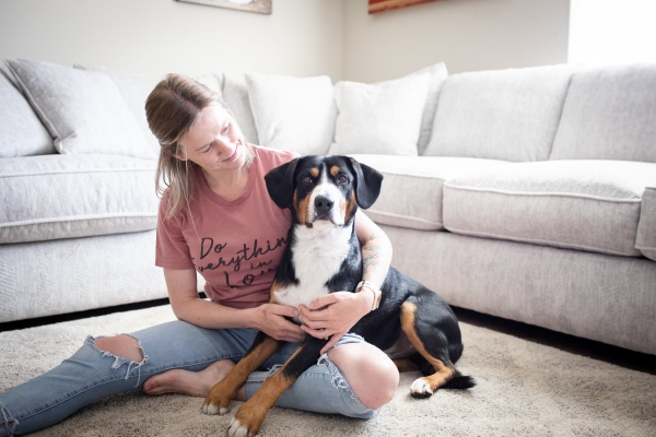 Owner holding a dog that has been on Trazodone