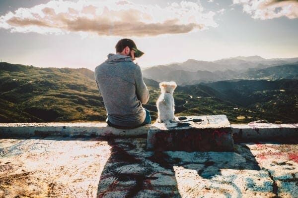 dog and man sitting together, photo